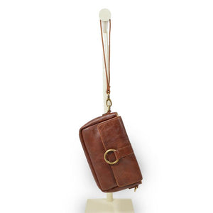 Small leather crossbody bag with a brass ring on the front, Sabrina Crossbody Bag.